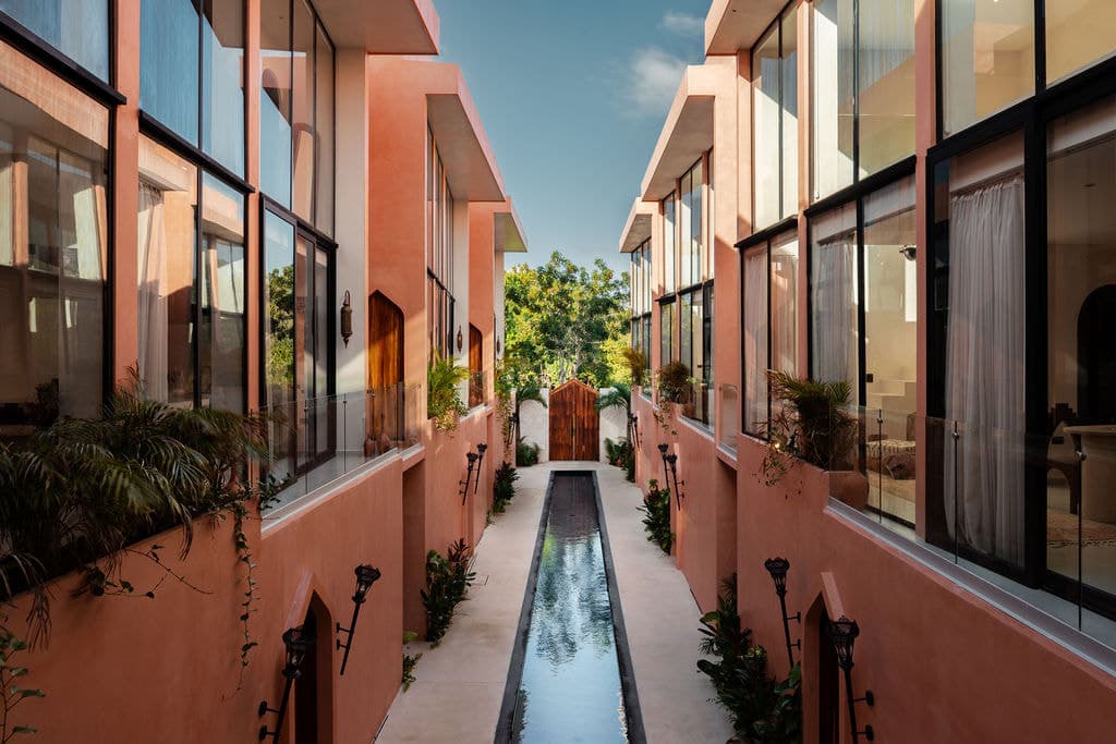 Terracotta wings facing each other across the central water channel