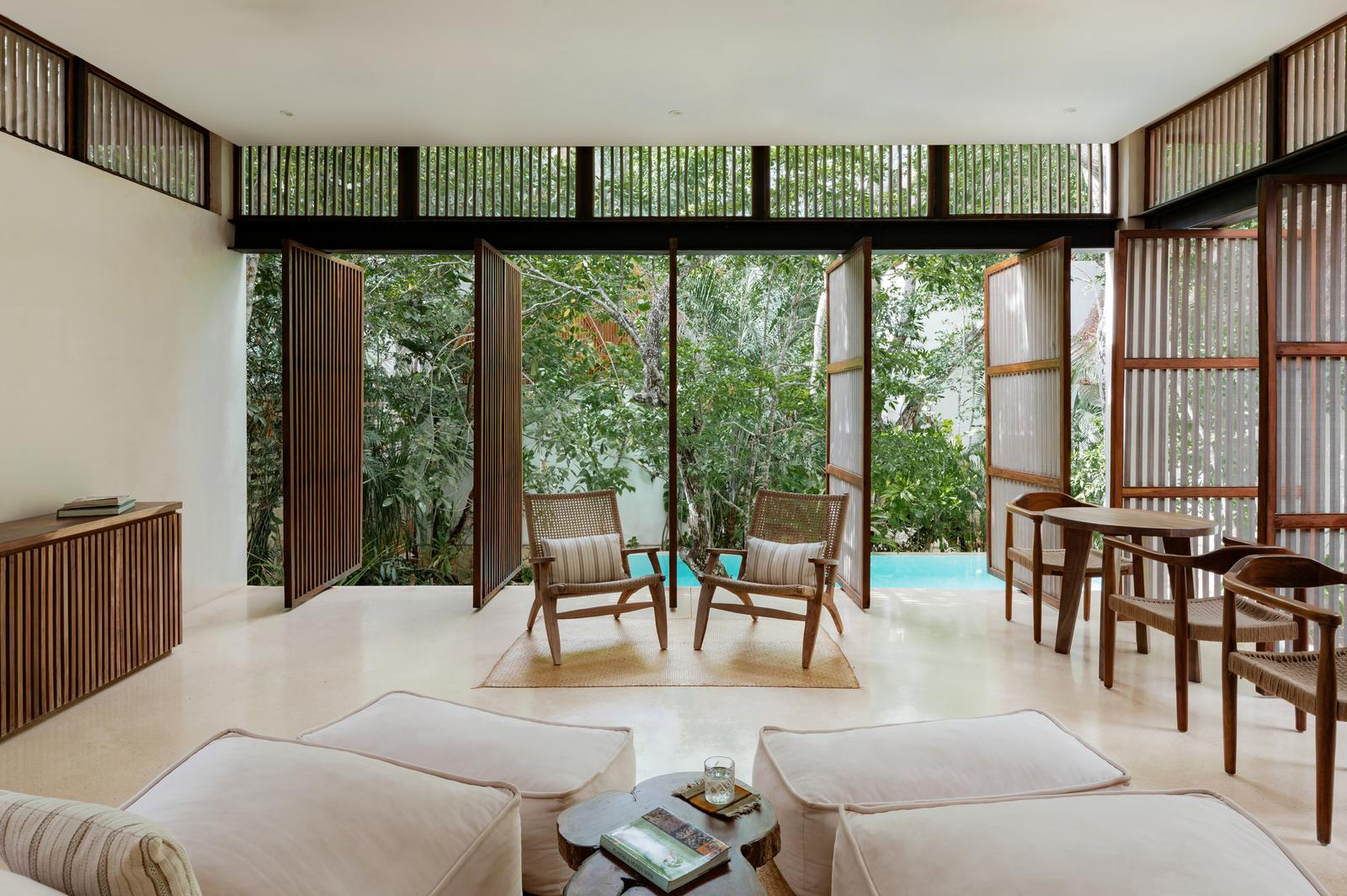 Clubroom opening onto the jungle through full-height glass