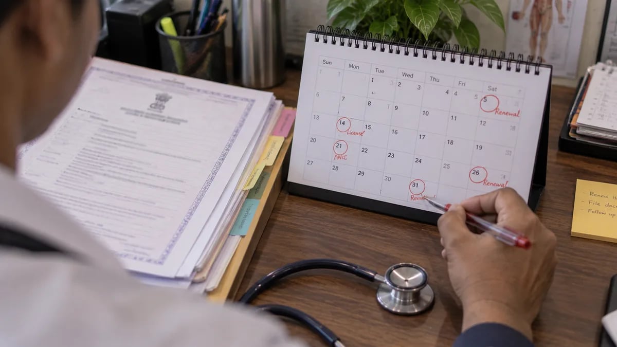 Alt text: A clinic office calendar with several licence renewal dates circled
