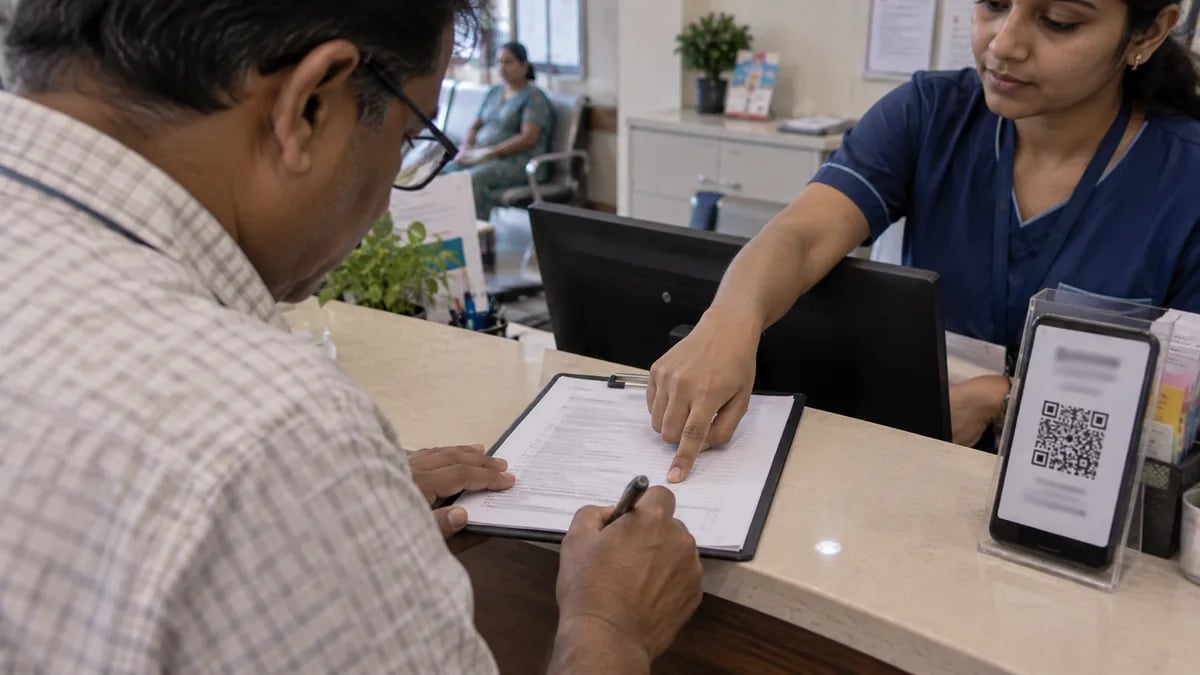 A patient signing a consent form at reception that includes agreeing to WhatsApp updates