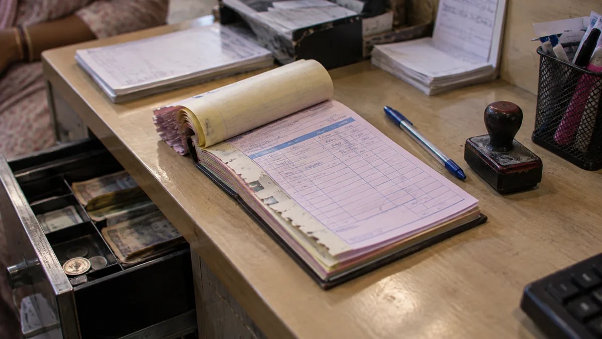 A clinic bill book with missing stubs and a half-filled page