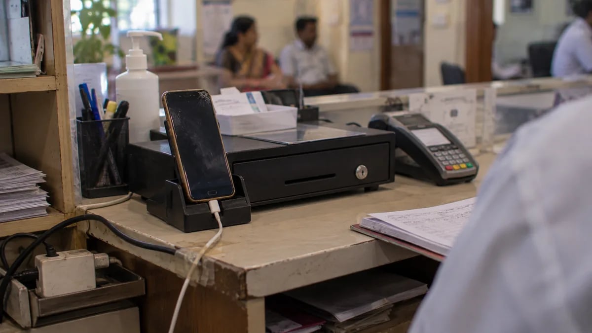 An old budget Android phone kept as the clinic's billing phone