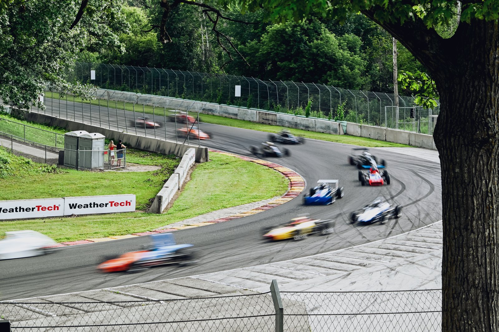 Fans watching vintage race cars from Canada Corner at Road America.