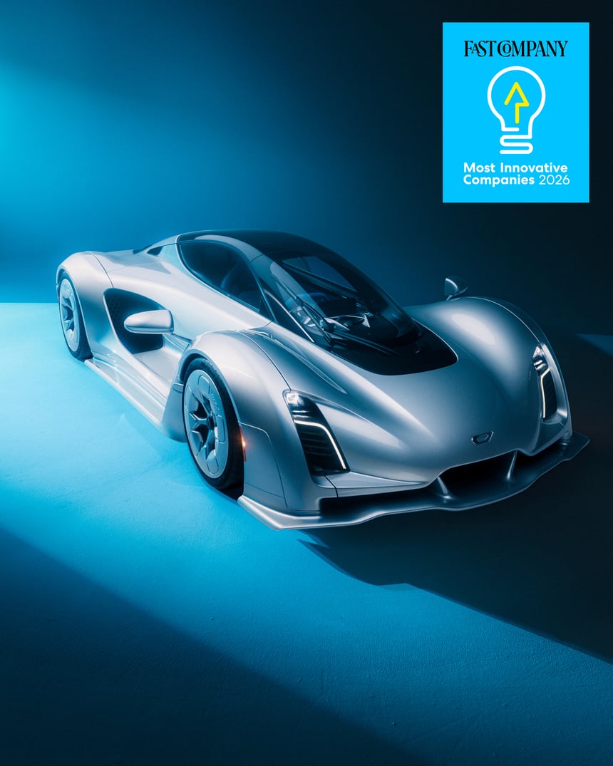 Front 3/4 exterior view of a silver Czinger sports car under blue lighting, with text "FAST COMPANY Most Innovative Companies 2026".