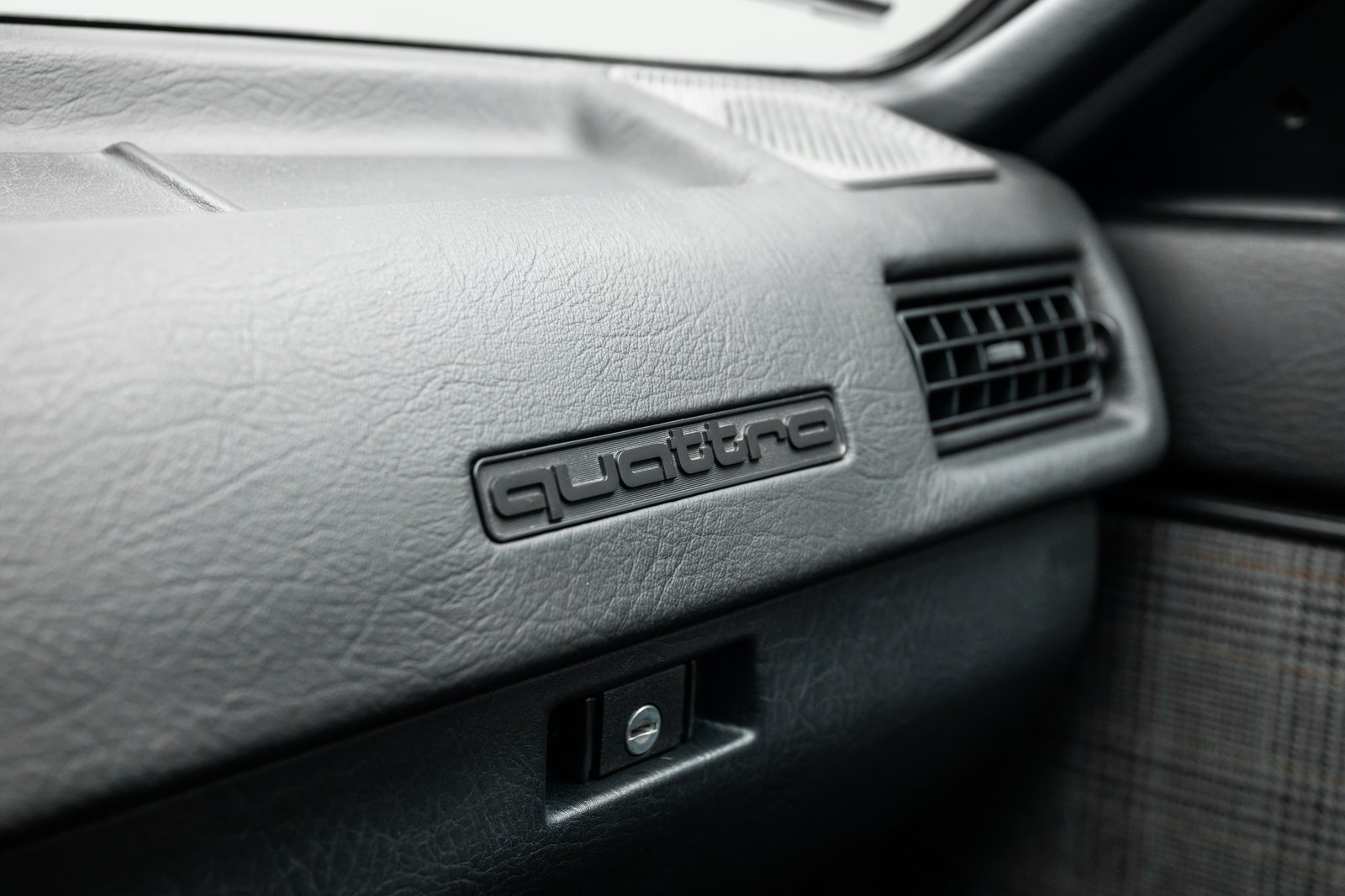 Dashboard detail with quattro badging inside the 1986 Audi WR Ur-Quattro.