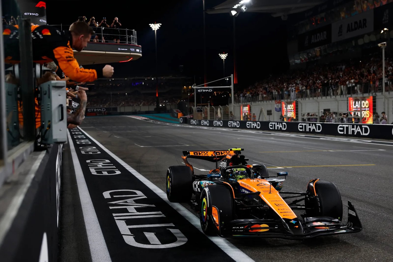 Lando Norris crosses the finish line after being crowned world champion in Abu Dhabi.