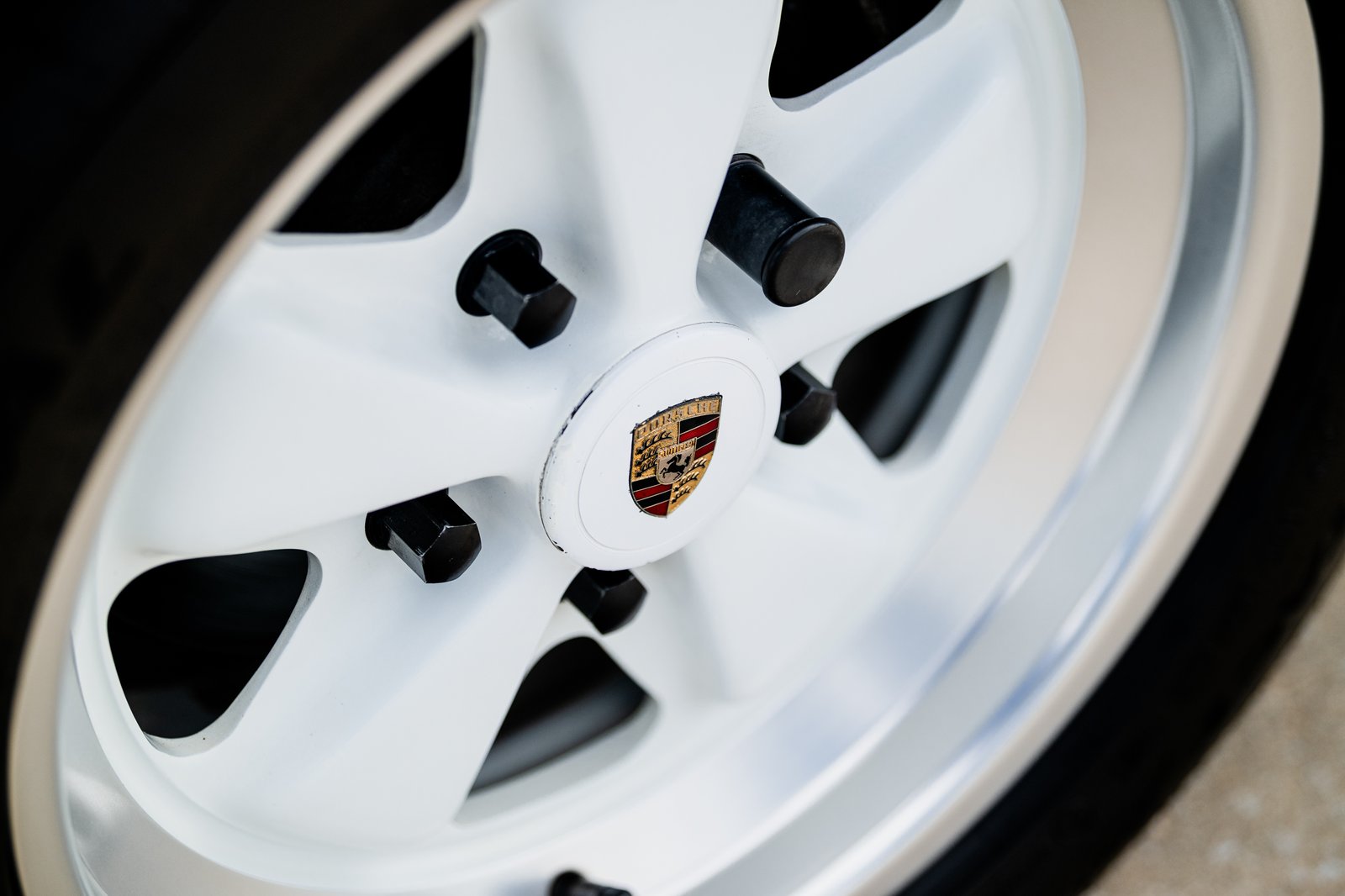 Body-color Fuchs wheel detail on the 1988 Porsche 911 Carrera Cabriolet.