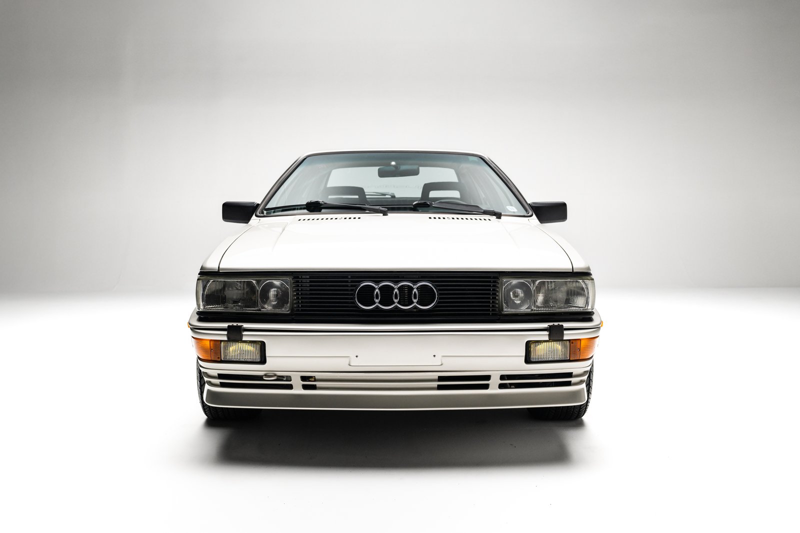 Head-on studio view of the 1986 Audi WR Ur-Quattro showing the grille and rectangular lighting.