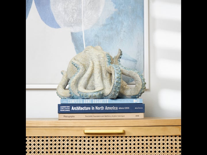 beige-polystone-textured-octopus-sculpture-with-light-blue-tentacles-1