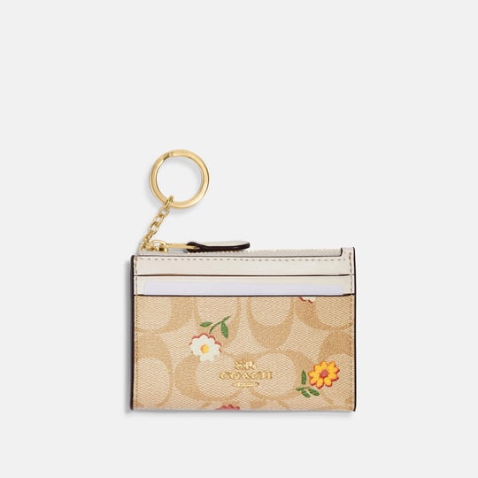 coach-outlet-mini-skinny-id-case-in-signature-canvas-with-nostalgic-ditsy-print-multi-1