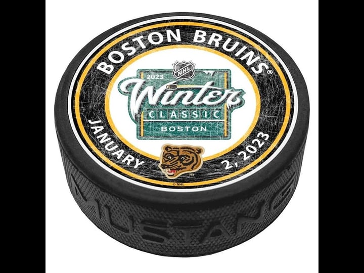 nhl-winter-classic-boston-bruins-center-ice-puck-2023-1