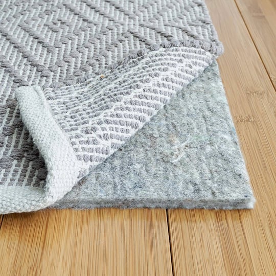 rugpadusa-basics-7-round-3-8-thick-100-felt-protective-cushioning-rug-pad-safe-for-all-floors-and-fi-1