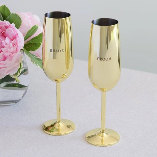 style-me-pretty-gold-bride-groom-toasting-flutes-michaels-1