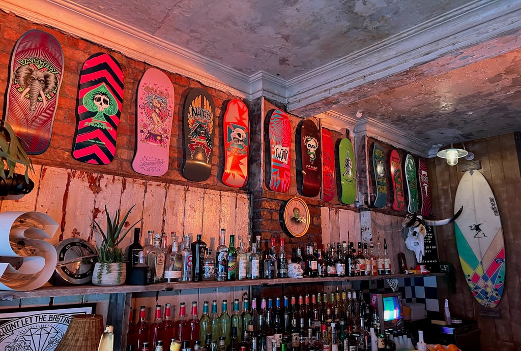 Dogtown surf and skate boards line the walls