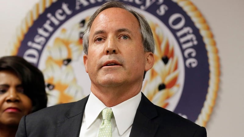 Ken Paxton speaks at a news conference.
