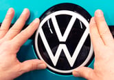 The Volkswagen logo is seen on the body of a car being assembled in Germany