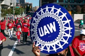 United Auto Workers members walk in the Labor Day parade in Detroit in 2019.