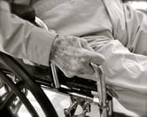 An elderly man in a wheelchair.