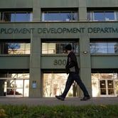 Person passes a government unemployment office.