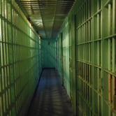 A series of jail cells is pictured.