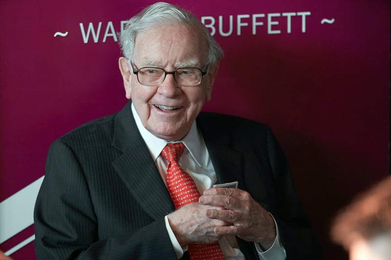 Warren Buffett smiles while playing bridge.