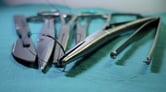 Surgery tools on a blue sterile sheet