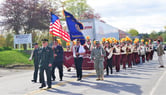 The 2019 Memorial Day Parade in Monson, Maine is being led by a retired colonel, followed by the marching band from nearby Foxcroft Academy.