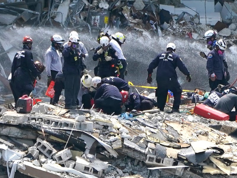 Rescue Team Battles Fire and Rain in Search for Condo Collapse ...