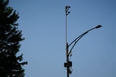 ShotSpotter equipment overlooks the intersection of South Stony Island Avenue and East 63rd Street in Chicago.