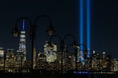 Two vertical columns of light representing the fallen towers of the World Trade Center.