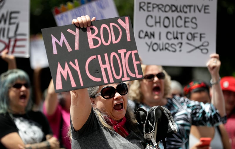 A group gathers to protest abortion restrictions at the State Capitol in Austin, Texas.