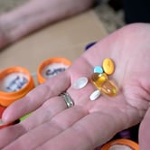 Retiree Donna Weiner shows some of her daily prescription medications.