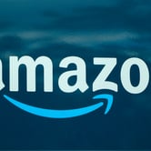 An Amazon logo appears on an Amazon delivery van.