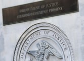 A Federal Bureau of Prisons sign is displayed in New York.
