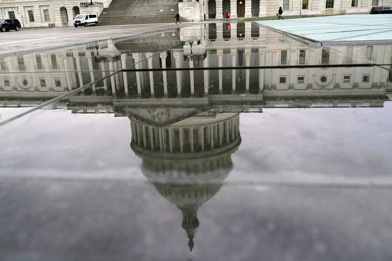 The reflection of the U.S. Capitol on a rainy morning.