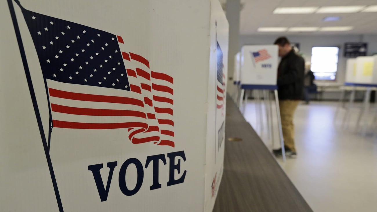 Photo: Courthousenews A man casts a ballot during early voting in Cleveland in March 2020. (Tony Dejak/AP)