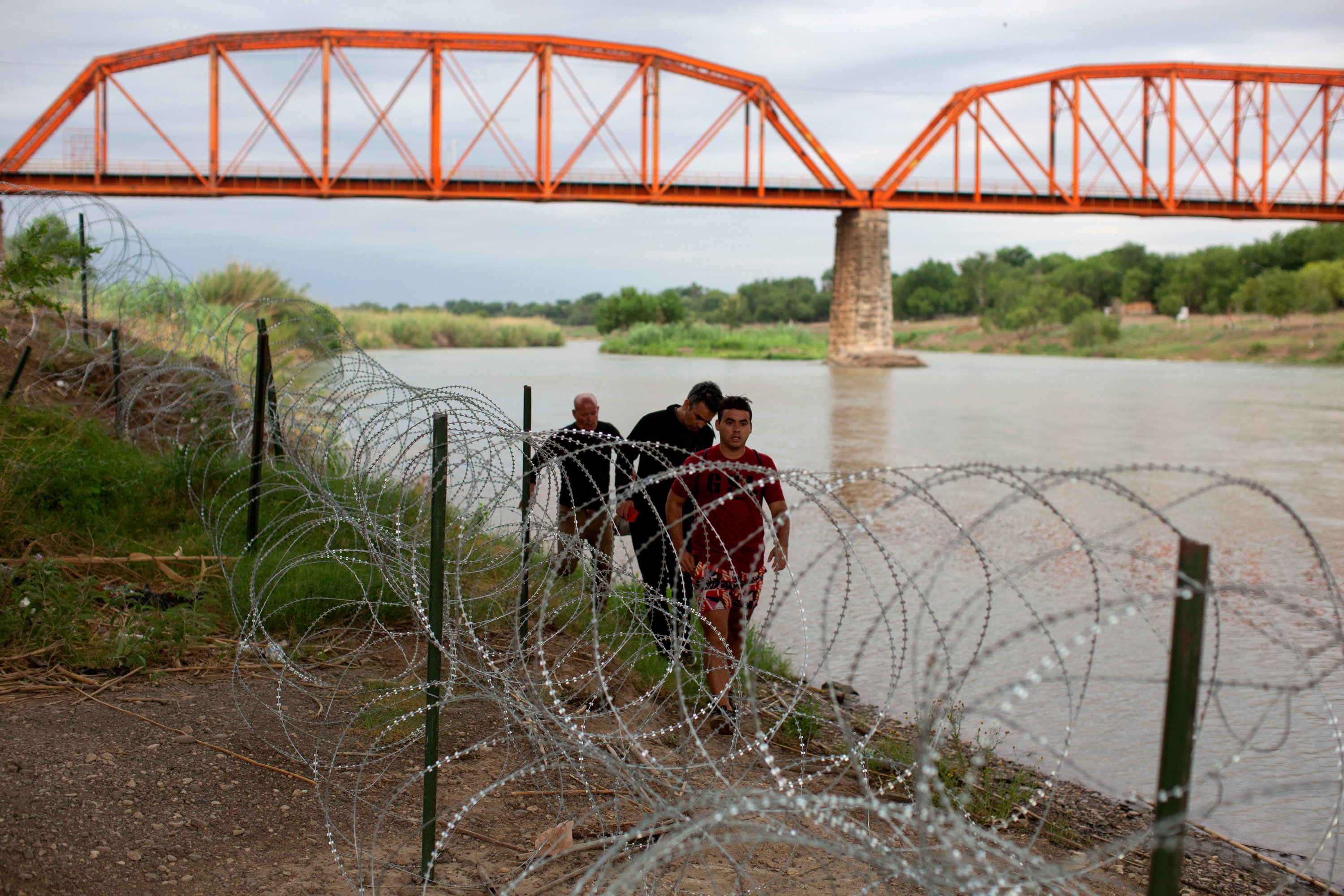 DOJ takes aim at Texas’ floating border barrier in federal court ...