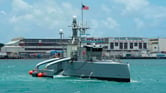 A crewless sea vessel arrives at Pearl Harbor.