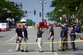 FBI agents assemble at the scene of a mass shooting in a Chicago suburb
