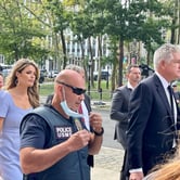 a group of U.S. Marshals surround Donald Trump's attorneys M. Evan Corcoran and Lindsey Halligan as they enter Brooklyn federal court