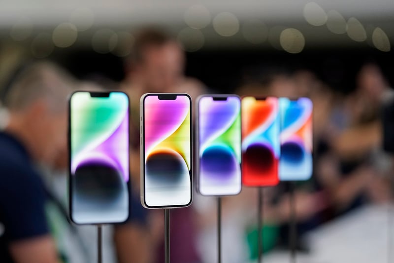 New iPhone 14 models on display at an Apple event in California.