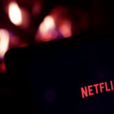 The Netflix logo appears on a tablet.