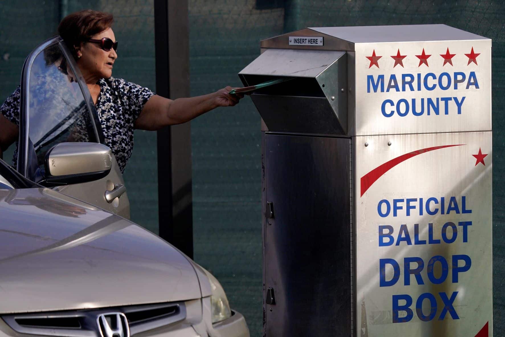 Judge orders armed group away from Arizona ballot drop boxes