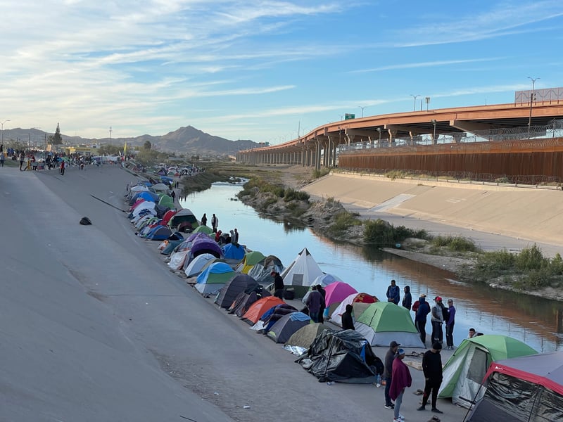 Tents pitched on the southern banks of the Rio Grande river