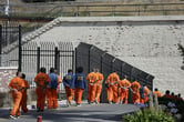 A line of prison inmates.