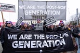 Anti-abortion activists march outside of the Supreme Court during the March for Life in Washington.