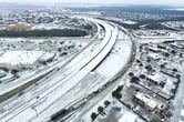 An icy mix covers a highway outside of Dallas.