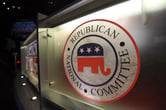 The Republican National Committee logo on a debate stage.
