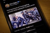 A tweet showing AI-generated images of Donald Trump getting arrested by police officers is displayed on a smartphone.
