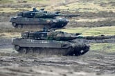 Leopard 2 tanks in action at a German military base.